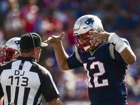 Tom Brady of the New England Patriots argues with the referee during the third quarter of a game against the New York Jets at Gillette Stadium on September 22, 2019 in Foxborough, Massachusetts.