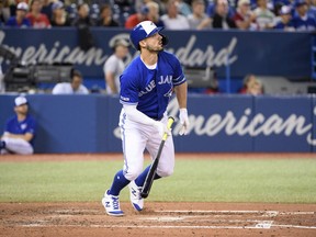 Blue Jays centre fielder Randal Grichuk watches his ball leave the Rogers Centre on Sunday against the New York Yankees. Grichuk leads Toronto with 28 home runs this season. (Nick Turchiaro/USA TODAY Sports)