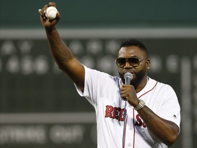 Former Boston Red Sox player David Ortiz talks to the crowd after throwing out the ceremonial first pitch before the game against the New York Yankees at Fenway Park, Sept. 9, 2019. (Greg M. Cooper/USA TODAY Sports