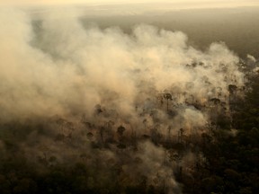 Smoke billows during a fire in an area of the Amazon rainforest near Porto Velho, Rondonia State, Brazil, Sept. 10, 2019. REUTERS/Bruno Kelly