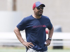 Alouettes head coach Khari Jones gives instruction to players during practice in Montreal on June 10, 2019.