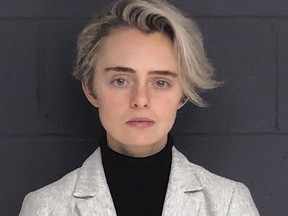 This Feb. 11, 2019, booking photo released by the Bristol County Sheriff's Office shows Michelle Carter. The Massachusetts woman sentenced to 15 months in jail for urging her suicidal boyfriend via text messages to take his own life is asking for early release. Carter is scheduled to appear Thursday, Sept. 19 before the state Parole Board after serving seven months. She was convicted in 2017 of involuntary manslaughter in the death of 18-year-old Conrad Roy III. (Bristol County Sheriff's Office via AP, File)