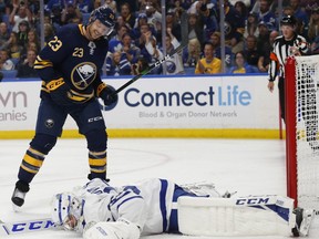 Buffalo Sabres forward Sam Reinhart (23) watches the puck go past Toronto Maple Leafs goalie Michal Neuvirth (35) during the second period of an NHL preseason hockey game Saturday, Sept. 21, 2019, in Buffalo, N.Y. THE CANADIAN PRESS/AP-Jeffrey T. Barnes