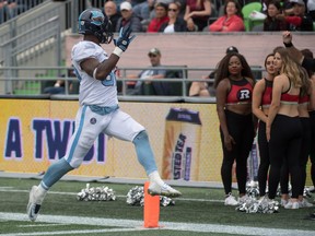 Argonauts running back James Wilder Jr. waves to the Redblacks cheerleaders as he scores a touchdown in Saturday's romp at TD Place in Ottawa.