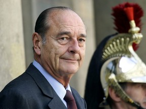 Then French President Jacques Chirac waits for the arrival of a guest at the Elysee Palace in Paris, France, October 4, 2004.  REUTERS/Charles Platiau