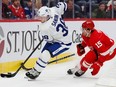 Toronto Maple Leafs defenceman Rasmus Sandin controls the puck while being chased by Red Wings' Chris Terry in the second period at Little Caesars Arena, Friday, Sept. 27, 2019.