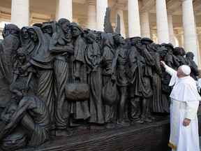Pope Francis attends the unveiling of the sculpture commemorating migrants and refugees entitled "Angels Unawares" by Canadian artist Timothy Schmaltz in St Peter's Square in Vatican, September 29, 2019.  (Vatican Media/­Handout via REUTERS)