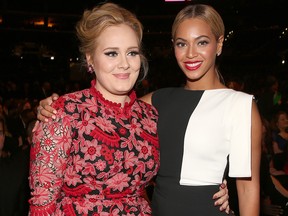 In this Feb. 10, 2013 file photo, singers Adele and Beyonce attends the 55th annual Grammy Awards at Staples Center in Los Angeles.