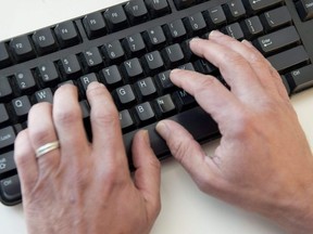 In this file photo taken on November 21, 2016 a man types on a computer keyboard in this photo illustration taken in Washington, DC. - An elite group of North Korean hackers has been identified as the source of a wave of cyberattacks on global banks that has netted "hundreds of millions" of dollars, security researchers said on October 3, 2018. A report by the cybersecurity firm FireEye said the newly identified group dubbed APT38 is distinct from but linked to other North Korean hacking operations, and has the mission of raising funds for the isolated Pyongyang regime.