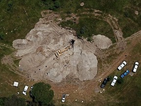 Aerial view of the zone where forensic experts are working using an excavator to dig in an old 30-meter well turned into a mass grave where, up to now, 75 bags with human remains have been found, in the community La Primavera in Zapopan, near Guadalajara, state of Jalisco Mexico, on September 10, 2019.