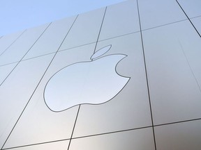In this file photo taken on September 22, 2017 an Apple logo is seen on the outside of an Apple store as new iPhones are released for sale in San Francisco, California.