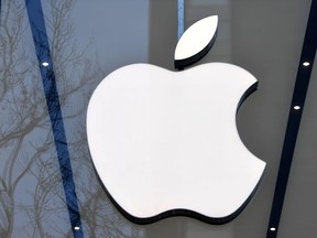 In this file photo taken on February 08, 2018 the logo of the US multinational technology company Apple is on display on the facade of an Apple store in Brussels.