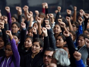 Students and relatives of the 43 students of the teaching training school in Ayotzinapa who went missing on September 26, 2014, protest ahead of the fifth anniversary of their disappearance, in Mexico City on September 25, 2019. - The Mexican prosecutor-general's office said -last September 18- it will reinvestigate "almost from scratch" the disappearance and suspected massacre of 43 students in 2014, a case that still haunts the country.