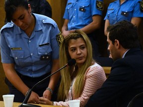 Photo released by Telam of Argentinian Brenda Barattini (C) during her trial in Cordoba, Argentina, on September 25, 2019. - Barattini was sentenced to 13 years for attempted homicide aggravated  with malice aforethought for cutting off her lover's genitals with pruning shears.