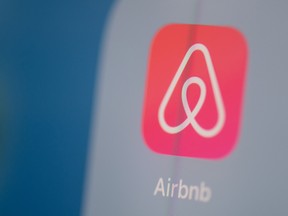 This photo illustration  taken on July 24, 2019 in Paris shows Airbnb's logo on the screen of a tablet.