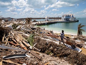 Workers clean debris at the Abaco Inn in Hurricane Dorian devastated Elbow Key Island on Sept. 7, 2019 in Elbow Key Island, Bahamas.