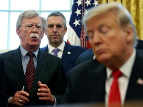 President Donald Trump listens as his national security adviser John Bolton speaks during a presidential memorandum signing for the "Women's Global Development and Prosperity" initiative in the Oval Office at the White House in Washington, U.S., February 7, 2019. (REUTERS/Leah Millis/File Photo)