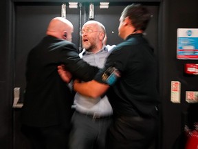 A man is removed after heckling Prime Minister Boris Johnson's speech at the Convention of the North, in the Magna Centre in Rotherham September 13, 2019. (CHRISTOPHER FURLONG/AFP/Getty Images)