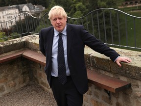 Britain's Prime Minister Boris Johnson poses for a photograph prior to giving a statement after a meeting with Luxembourg's Prime Minister Xavier Bettel, in Luxembourg, September 16, 2019. (Francisco Seco/Pool via REUTERS)