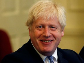 British Prime Minister Boris Johnson attends a roundtable at Downing Street in London, Britain, September 19, 2019.