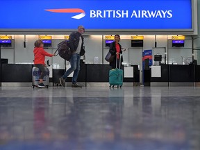 Passengers hoping to catch a rare flight are seen in a near-deserted departure area at Heathrow airport Terminal 5 in London on September 9, 2019, as the airline's first-ever pilots' strike began. (BEN STANSALL/AFP/Getty Images)