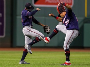 Minnesota Twins left fielder Eddie Rosario (20) and Twins center fielder Byron Buxton (25) celebrate after defeating the Boston Red Sox at Fenway Park. (Paul Rutherford-USA TODAY Sports)