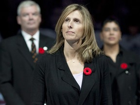 Cammi Granato (centre) stands at centre ice after being inducted into the Hockey Hall of Fame before Toronto Maple Leafs and Buffalo Sabres NHL hockey in Toronto on Saturday November 6, 2010. (THE CANADIAN PRESS/Chris Young)