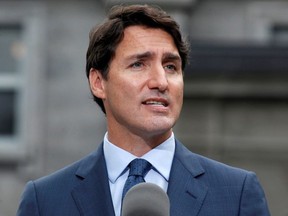 Canada's Prime Minister Justin Trudeau speaks during a news conference at Rideau Hall after asking Governor General Julie Payette to dissolve Parliament.