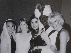 Canada's Prime Minister Justin Trudeau, with his face and hands painted brown, poses with others during an "Arabian Nights" party when he was a 29-year-old teacher at the West Point Grey Academy in Vancouver, Canada, in this photo published in the academy's 2000-2001 yearbook. This image, published in The View yearbook, was obtained by Time.