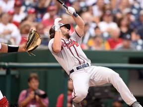 Braves batter Charlie Culberson reacts after getting hit by a ball in the face during seventh inning MLB action against the Nationals at Nationals Park Washington, DC, on Saturday, Sept. 14, 2019.