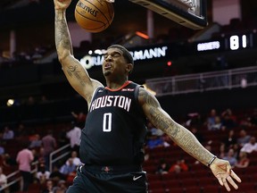 In this Oct. 30, 2018, file photo, Marquese Chriss of the Houston Rockets dunks during the fourth quarter Portland Trail Blazers at Toyota Center in Houston,Texas.