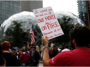 Jeff Quinlan-Galper, a software engineer for Google, holds a sign with a quote from climate activist Greta Thunberg during a Climate Strike walkout and march in Seattle, Washington, U.S. September 20, 2019.