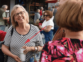 This version of the photo that was posted to the Green Party website shows Elizabeth May holding a reusable cup with a metal straw that were Photoshopped in.