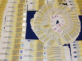 Counterfeit bank notes seized by police in Porto in 2013. (Getty Images file photo)