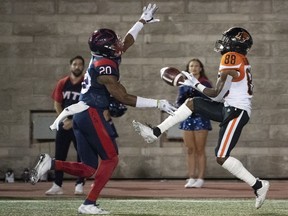 Alouettes linebacker Boseko Lokombo breaks up a pass intended for BC Lions wide receiver Shaq Johnson during fourth quarter CFL football action in Montreal on Friday, Sept. 6, 2019.