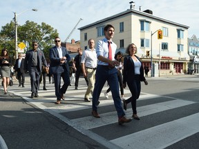 Liberal Leader Justin Trudeau crosses a street as he makes his way to make a policy announcement in Toronto on Friday, Sept. 20, 2019.