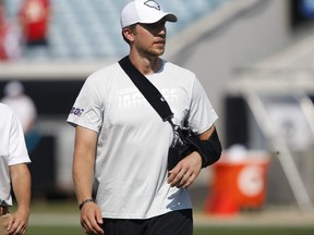 An injured Jacksonville Jaguars quarterback Nick Foles walks on the field with his arm in a sling following a game against the Kansas City Chiefs at TIAA Bank Field.