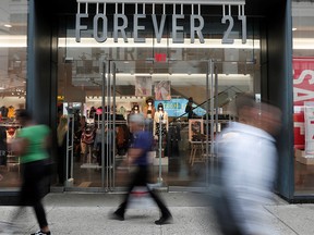 People walk by the clothing retailer Forever 21 in New York City on Sept. 12, 2019. (REUTERS/Shannon Stapleton)
