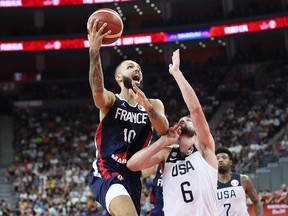 Evan Fournier of France puts up a shot as Joe Harris of the U.S.A. defends during the FIBA World Cup quarterfinal at Dongguan Basketball Center on September 11, 2019 in Dongguan, China. (Lintao Zhang/Getty Images)