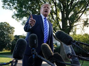 U.S. President Donald Trump speaks to members of the media prior to his departure for Camp David August 30, 2019 at the White House in Washington, DC.