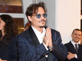Johnny Depp walks the red carpet ahead of the "Waiting For The Barbarians" screening during the 76th Venice Film Festival at Sala Grande on September 6, 2019 in Venice, Italy.