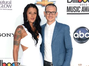 Chester Bennington of Linkin Park (R) and wife Talinda Ann Bentley (L) arrive at the 2012 Billboard Music Awards held at the MGM Grand Garden Arena on May 20, 2012 in Las Vegas, Nevada.