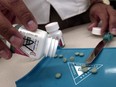 The prescription medicine OxyContin is displayed August 21, 2001 at a Walgreens drugstore in Brookline, MA. The powerful painkiller, manufactured to relieve the pain of seriously ill people, is being used by some addicts to achieve a high similar to a heroin rush.