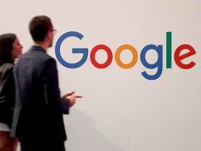 Visitors pass by the logo of Google at the high profile startups and high tech leaders gathering, Viva Tech,in Paris, France May 16, 2019.