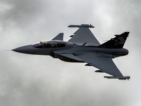 Swedish manufacturer Saab's Gripen F fighter jet of the Swiss Air Force performs on Oct. 11, 2012, during a flight demonstration of the Swiss Air Force over Axalp in the Bernese Oberland.