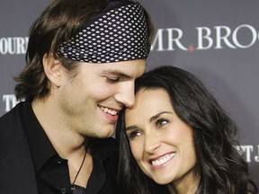 US actress Demi Moore and husband Ashton Kutcher arrive for the premiere of "Mr. Brooks" at Grauman's Chinese Theater, 22 May 2007, in Hollywood, California.