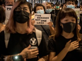 Pro-democracy protesters sing songs and shout slogans as they gather in a shopping mall during a rally in Yeun Long district on September 21, 2019 in Hong Kong, China. (Chris McGrath/Getty Images)