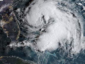 This satellite image obtained from NOAA/RAMMB, shows Tropical Storm Humberto as it moves near the Bahamas on September 15, 2019. (HO / NOAA/RAMMB / AFP)