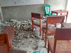 Concrete rubble are seen on the floor of a classroom at Al Anshor Islamic Boarding School after an earthquake in Ambon, Maluku province, Indonesia, Sept. 26, 2019, in this still image from video obtained via social media.