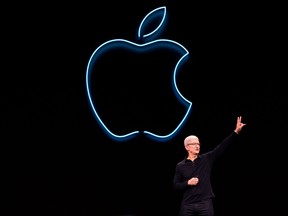 In this file photo taken on June 3, 2019 Apple CEO Tim Cook presents the keynote address during Apple's Worldwide Developer Conference (WWDC) in San Jose, Calif.